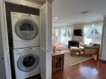 Full sized stackable washer and dryer in hall closet